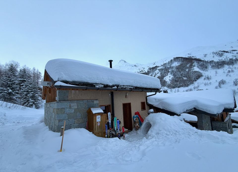 Chalet Gabriel under a deep roof of snow.